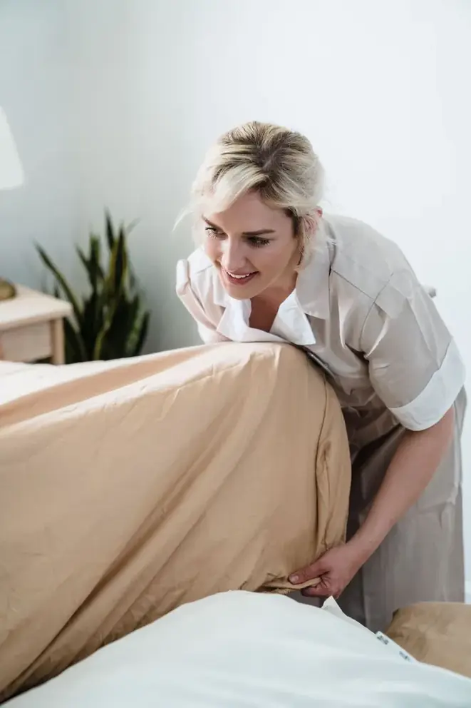 Cleaner wiping down a modern kitchen counter