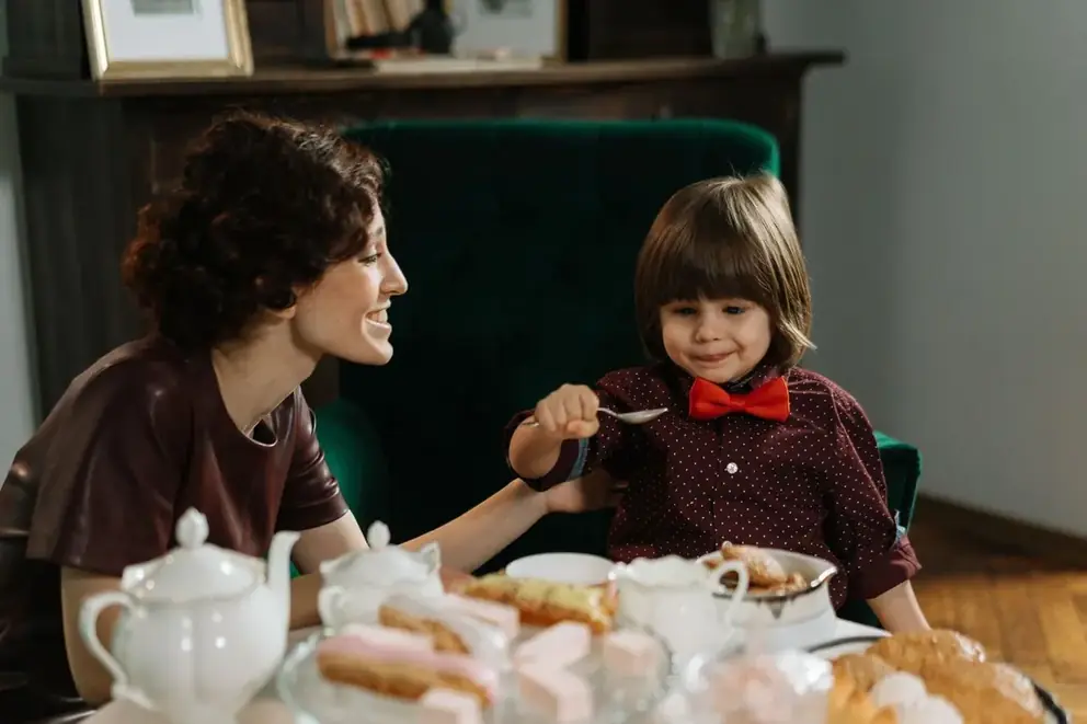Nanny caring for a young child at home